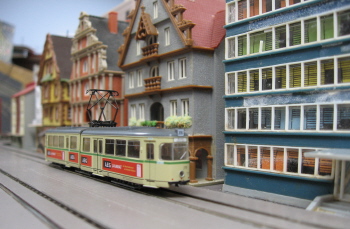 Arnold N scale Duewag tram on a German-themed EasyTrolley layout.